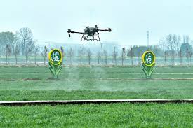 Lighting drone helps agricultural machines harvest wheat at night in China’s Anhui